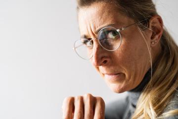 Portrait of an upset, angry and unhappy casual women look over the shoulder face expression emotion reaction : Stock Photo or Stock Video Download rcfotostock photos, images and assets rcfotostock | RC Photo Stock.: