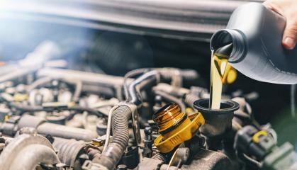 Pouring oil to car engine. Fresh motor oil poured during an oil change to a car. : Stock Photo or Stock Video Download rcfotostock photos, images and assets rcfotostock | RC-Photo-Stock.: