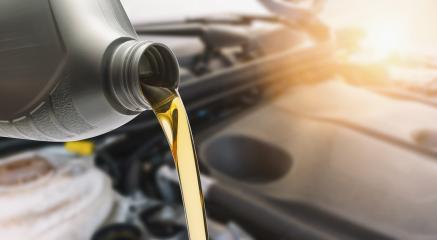 Pouring oil to car engine, Fresh oil poured during an oil change to a car.- Stock Photo or Stock Video of rcfotostock | RC Photo Stock