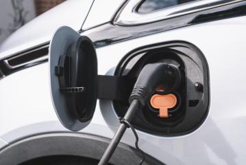 Power supply for electric car charging. Electric car charging station. Close up of the power supply plugged into an electric car being charged.- Stock Photo or Stock Video of rcfotostock | RC Photo Stock