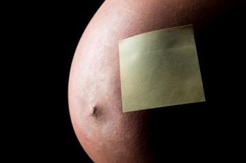 Pregnant woman belly with Sticky Note- Stock Photo or Stock Video of rcfotostock | RC Photo Stock