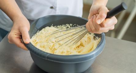 professional baker woman holding bowl with whisk to beat butter until stiff at a bakery : Stock Photo or Stock Video Download rcfotostock photos, images and assets rcfotostock | RC Photo Stock.: