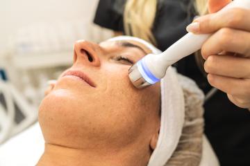 Professional cosmetology. Smart skilled cosmetologist using a modern device while doing hydrafacial procedure at a  cosmetology salon. : Stock Photo or Stock Video Download rcfotostock photos, images and assets rcfotostock | RC Photo Stock.: