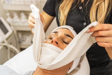 professional facial skin care treatment with towel at beauty salon- Stock Photo or Stock Video of rcfotostock | RC Photo Stock