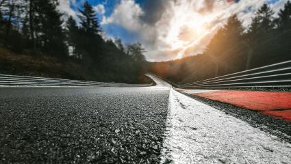 Race Car / motorcycle racetrack after rain on a cloudy mixed weather day.- Stock Photo or Stock Video of rcfotostock | RC-Photo-Stock