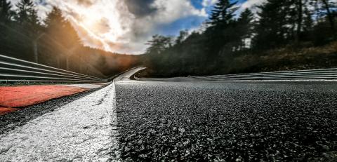 Race Car / motorcycle racetrack after rain on a cloudy mixed weather day.- Stock Photo or Stock Video of rcfotostock | RC-Photo-Stock