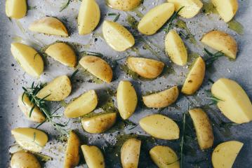 raw potato wedges with oil and pepper on baking tray, food concept background- Stock Photo or Stock Video of rcfotostock | RC Photo Stock