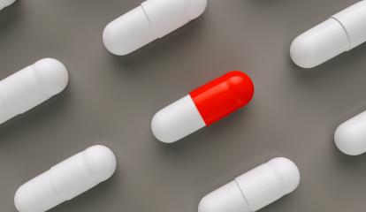 red and white pills or capsules lies in rows, medicine tablets antibiotic, Pharmacy theme- Stock Photo or Stock Video of rcfotostock | RC-Photo-Stock