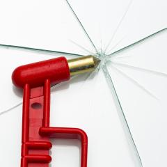 red emergency hammer with breaked glass window rescue hammer on white background- Stock Photo or Stock Video of rcfotostock | RC Photo Stock
