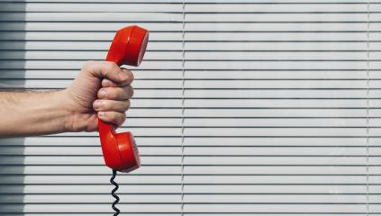 Red phone over office background concept for customer support line or important call- Stock Photo or Stock Video of rcfotostock | RC-Photo-Stock