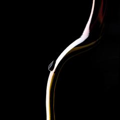 Red Wine bottle silhouette on Black Background with a drop on the bottleneck - Stock Photo or Stock Video of rcfotostock | RC Photo Stock