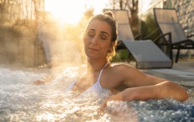 Relaxed woman in a hot tub with steam and sun rays- Stock Photo or Stock Video of rcfotostock | RC Photo Stock