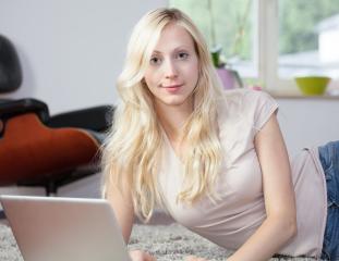Relaxed woman is using laptop- Stock Photo or Stock Video of rcfotostock | RC-Photo-Stock