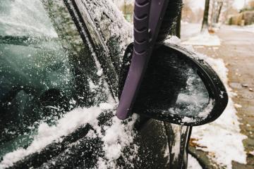 Removing snow from sideview mirror of a car with a brush : Stock Photo or Stock Video Download rcfotostock photos, images and assets rcfotostock | RC-Photo-Stock.: