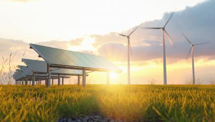 Renewable energy concept - photovoltaics and wind turbines on a grass filed at sunset- Stock Photo or Stock Video of rcfotostock | RC Photo Stock