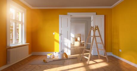 Renovation and modernization in a room with red wall and ladder and paint bucket- Stock Photo or Stock Video of rcfotostock | RC Photo Stock