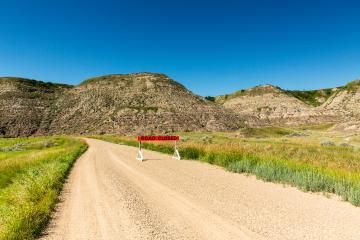 road closed at the drumheller badlands  : Stock Photo or Stock Video Download rcfotostock photos, images and assets rcfotostock | RC Photo Stock.:
