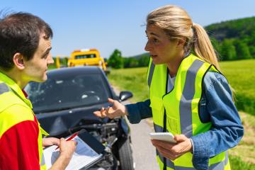 Roadside assistance worker discussing with a female client near a tow truck and her broken down car : Stock Photo or Stock Video Download rcfotostock photos, images and assets rcfotostock | RC Photo Stock.: