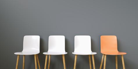 Row of chairs with one orange. Job opportunity. Business leadership. recruitment concept- Stock Photo or Stock Video of rcfotostock | RC-Photo-Stock