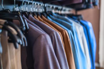 Row of various colored suits on hangers in a clothing store- Stock Photo or Stock Video of rcfotostock | RC Photo Stock