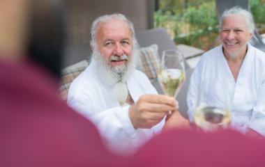 Senior couple in white bathrobes receiving champagne from a waiter in a spa hotel. Birthday and Valentines day concept image : Stock Photo or Stock Video Download rcfotostock photos, images and assets rcfotostock | RC Photo Stock.: