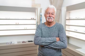 Senior customer with white hair smiling. He has his arms crossed- Stock Photo or Stock Video of rcfotostock | RC Photo Stock