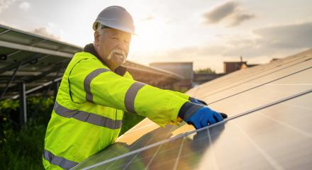 Senior engineer assembling solar panels at an energy farm during sunset. Alternative energy ecological concept image.- Stock Photo or Stock Video of rcfotostock | RC Photo Stock