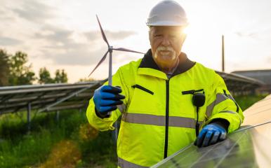 Senior engineer holding a wind turbine model at a solar photovoltaic panel system at sunset. Alternative energy ecological concept. : Stock Photo or Stock Video Download rcfotostock photos, images and assets rcfotostock | RC Photo Stock.: