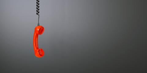 Shot of a landline red telephone receiver with copy space for individual text- Stock Photo or Stock Video of rcfotostock | RC Photo Stock
