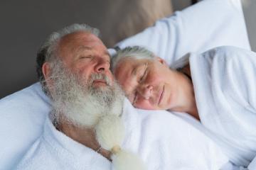 Sleeping senior couple relaxing  together on deck chair at wellness spa resort. Senior Moments concept image : Stock Photo or Stock Video Download rcfotostock photos, images and assets rcfotostock | RC Photo Stock.: