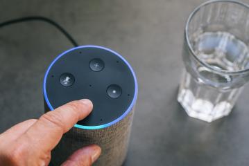 Smart speaker and male hand and a glass of water on a table- Stock Photo or Stock Video of rcfotostock | RC Photo Stock