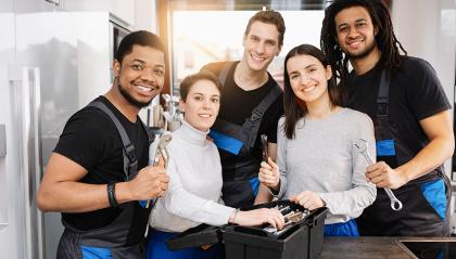 Smiling Team of Plumbers, trainees and Handymans standing in the kitchen : Stock Photo or Stock Video Download rcfotostock photos, images and assets rcfotostock | RC Photo Stock.: