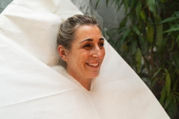 Smiling woman wrapped in a seat steam sauna, with greenery in the background at a wellness hotel : Stock Photo or Stock Video Download rcfotostock photos, images and assets rcfotostock | RC Photo Stock.: