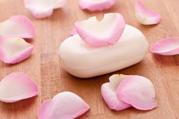 soap with rose leafs on wooden background- Stock Photo or Stock Video of rcfotostock | RC Photo Stock
