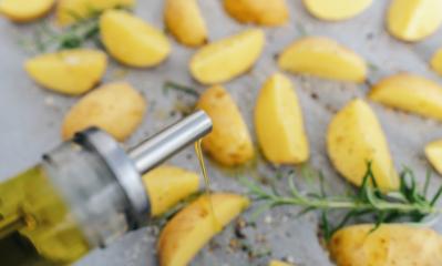spill oil out of can on raw potato wedges on baking tray - Stock Photo or Stock Video of rcfotostock | RC-Photo-Stock