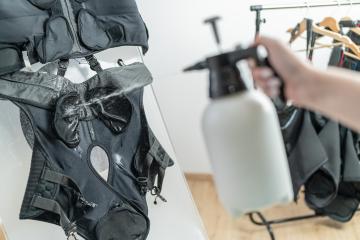 spray bottle spraying liquid onto an EMS training suit
 : Stock Photo or Stock Video Download rcfotostock photos, images and assets rcfotostock | RC Photo Stock.: