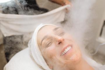 steaming the skin of the face of a happy woman before cleaning the skin in a cosmetology salon : Stock Photo or Stock Video Download rcfotostock photos, images and assets rcfotostock | RC Photo Stock.: