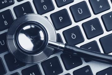 Stethoscope lying on laptop keyboard. Laptop infected by virus concept image- Stock Photo or Stock Video of rcfotostock | RC Photo Stock