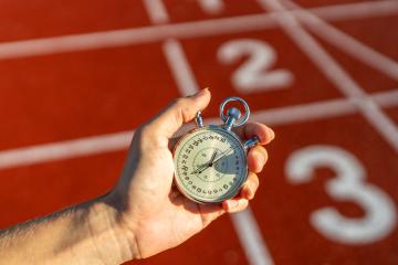 Stopwatch in hand, track numbers background, timing, sports, competition, measuring performance- Stock Photo or Stock Video of rcfotostock | RC Photo Stock