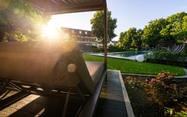 Sunset view from a poolside lounger in a landscaped garden- Stock Photo or Stock Video of rcfotostock | RC Photo Stock