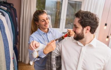 Tailor with measuring tape fitting a jacket on a male client at shop : Stock Photo or Stock Video Download rcfotostock photos, images and assets rcfotostock | RC Photo Stock.: