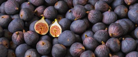 Tasty figs with halved fig on a pile- Stock Photo or Stock Video of rcfotostock | RC Photo Stock