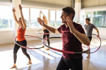 Team Sport women and men doing hula hoop in step waist hooping forward stance in fitness gym for healthy lifestyle concept. : Stock Photo or Stock Video Download rcfotostock photos, images and assets rcfotostock | RC Photo Stock.: