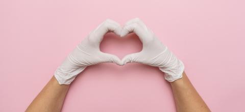Thanks you doctors  for tje Corona Vaccination in the pandemic, horizontal banner with copy space for text. Female hands in white gloves show symbol of heart shape on pink background. - Stock Photo or Stock Video of rcfotostock | RC-Photo-Stock