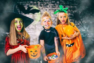 Three children dressed in Halloween costumes as a witch, pumpkin, and vampire, holding candy buckets and smiling in a spooky setting with bats, fog, and a glowing green moon in the background
 : Stock Photo or Stock Video Download rcfotostock photos, images and assets rcfotostock | RC Photo Stock.: