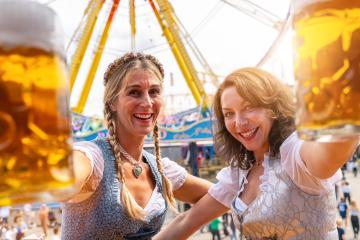 Toasting at oktoberfest or duld in Bavarian, with big beer mugs at summer- Stock Photo or Stock Video of rcfotostock | RC Photo Stock