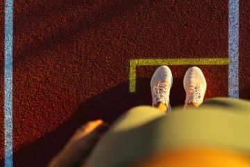 Top-down view of a person's feet at the start line on a running track : Stock Photo or Stock Video Download rcfotostock photos, images and assets rcfotostock | RC Photo Stock.: