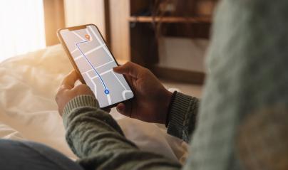 Tourist using GPS map navigation app on smartphone screen to get direction to destination address in the city at a hotel room, travel and technology concept image : Stock Photo or Stock Video Download rcfotostock photos, images and assets rcfotostock | RC Photo Stock.: