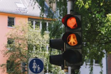 traffic light with red heart shape and Peace sign in the city : Stock Photo or Stock Video Download rcfotostock photos, images and assets rcfotostock | RC-Photo-Stock.: