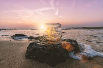 Transparent jar with lights from led at the beach at sunset. Romantic Hipster Concept image : Stock Photo or Stock Video Download rcfotostock photos, images and assets rcfotostock | RC-Photo-Stock.: